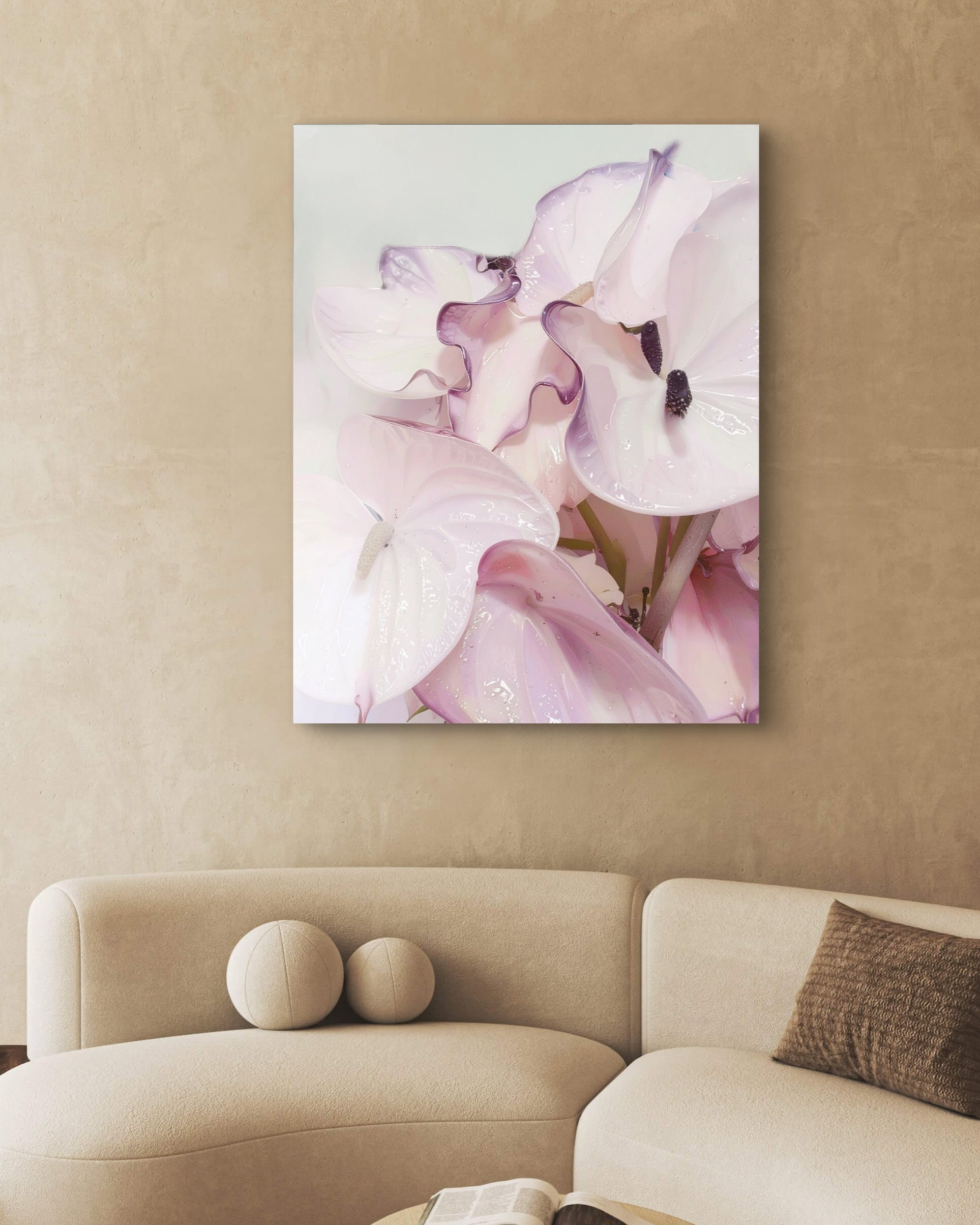 Floral painting on a wall above a beige sofa in a living room.